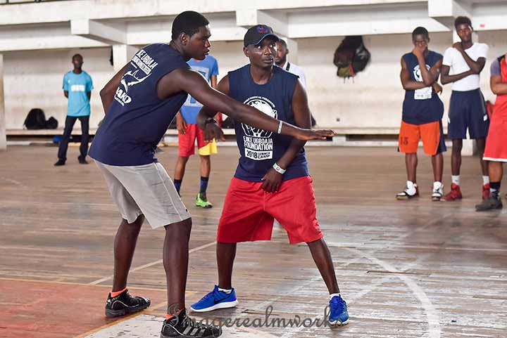 A coach instructing the boys during the Ejike Ugboaja Summer camp 2018